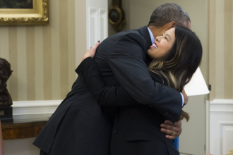 Nina Pham gets a hug from President Obama