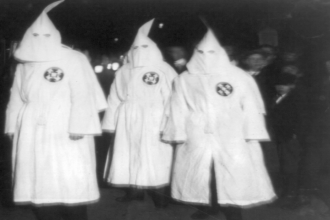 KKK members in 1922. Photo from the wikimedia commons.