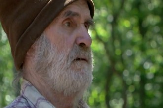 Sam watches on as his home is destroyed.