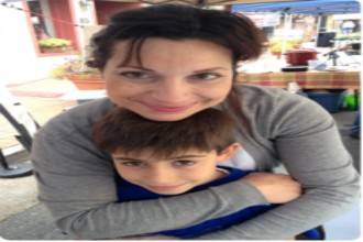 Toula Argentis posing with her son Nikolas, who sadly died from the flu last year. Image  via Dedicated To All Better