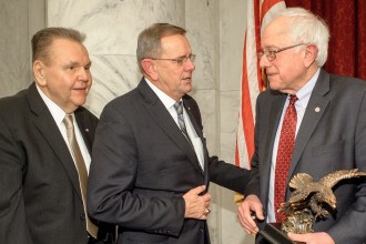 Bernie Sanders with his VFW Congressman of the year award. 
_______________________
Image Credit: http://www.sanders.senate.gov/imo/media/image/vfw1200.jpg